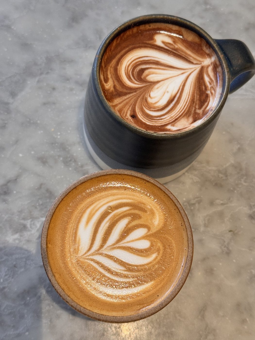 Two coffees with latte art