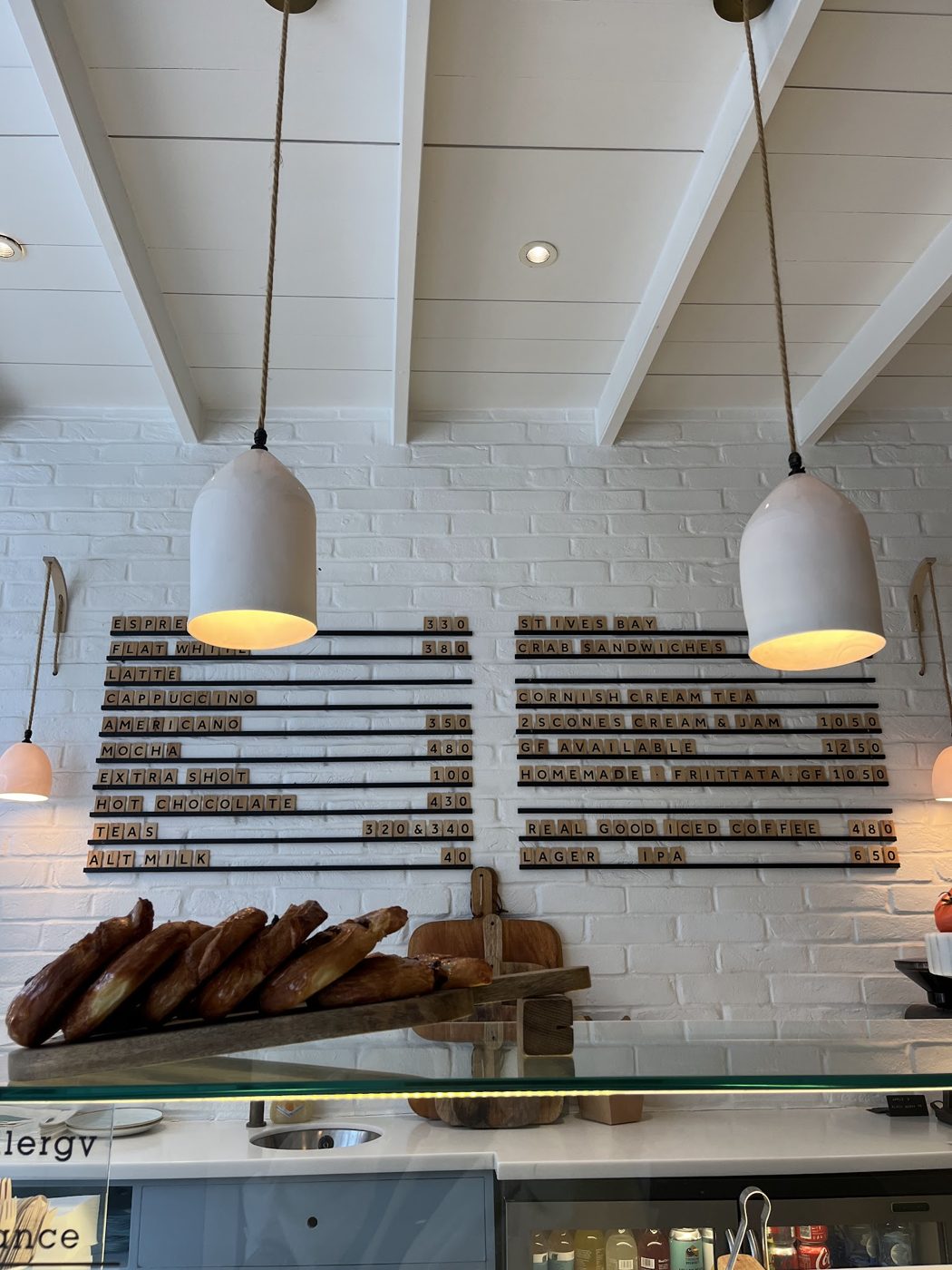 Inside: the counter, pendant lights and the letterboard menu