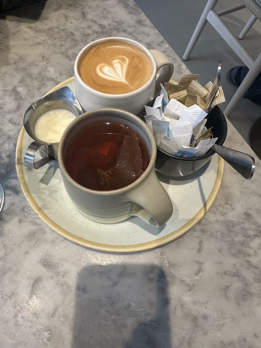 A flat white and a cup of tea